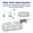 Load image into Gallery viewer, A playful kitten engages with a spinning feather cat toy on a colorful mat, designed for exciting hide-and-seek fun.