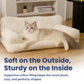 Load image into Gallery viewer, A relaxed cat lounges on a plush pet sofa showcasing its cozy, supportive design ideal for pet comfort.