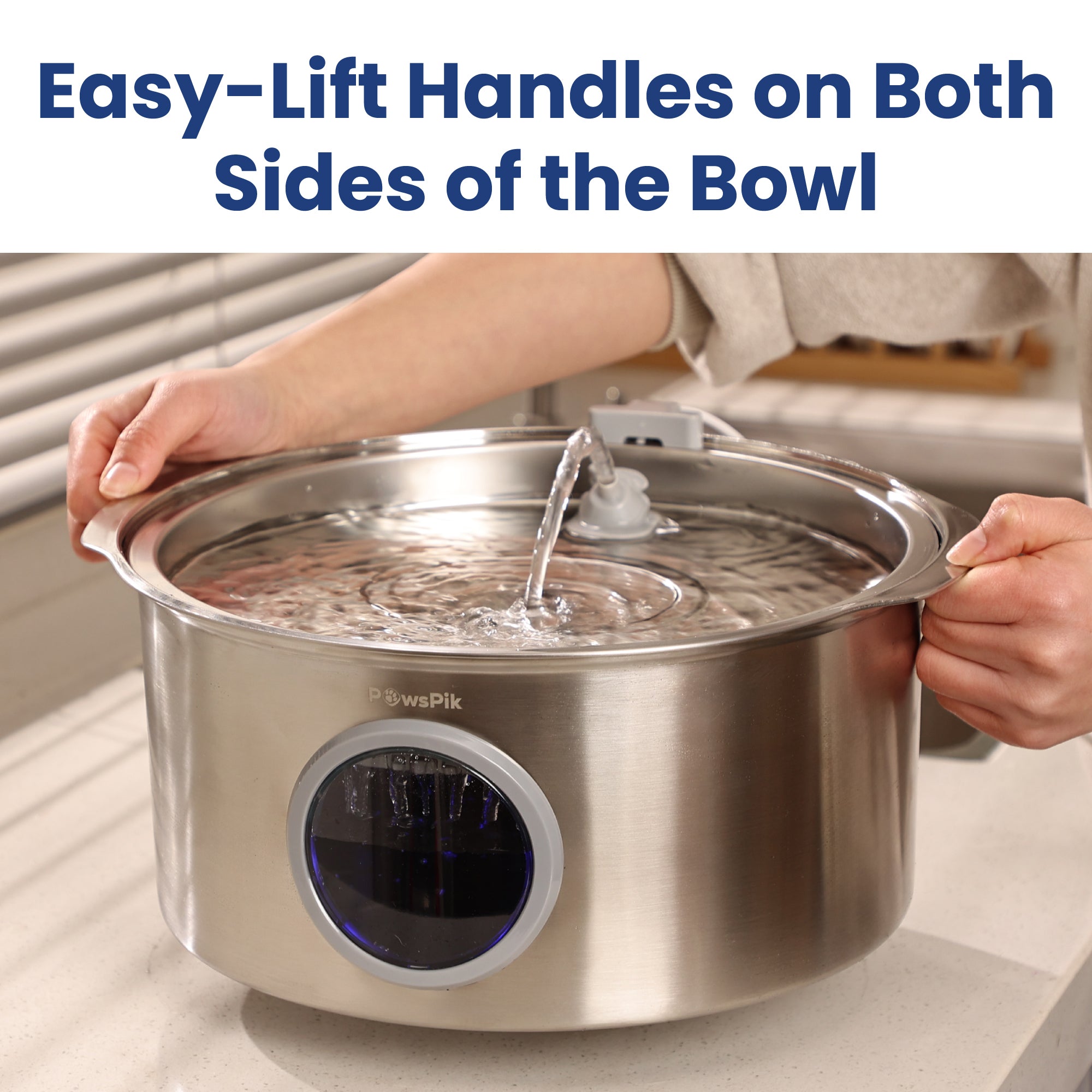 Close-up of a stainless steel Automatic Dog Water Bowl with easy-lift handles, featuring water and an indicator on the side.