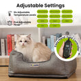 Load image into Gallery viewer, A fluffy cat sits in the PawsPik heated dog bed with adjustable settings, next to a graphic of a hand-held temperature controller.