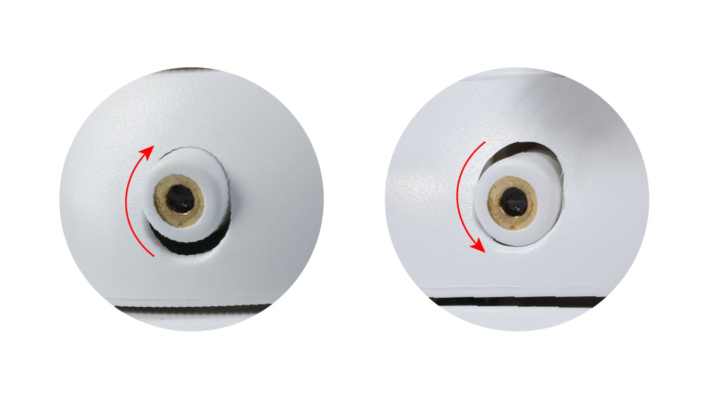Close-up of a white mechanism with arrows indicating clockwise and counterclockwise rotation, showing an adjustable feature of PawsPik Cat Toy.
