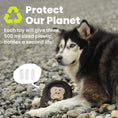 Load image into Gallery viewer, Dog with a PawsPik dog toy on pebbled ground with text: "Protect Our Planet" and details about recycling plastic bottles.
