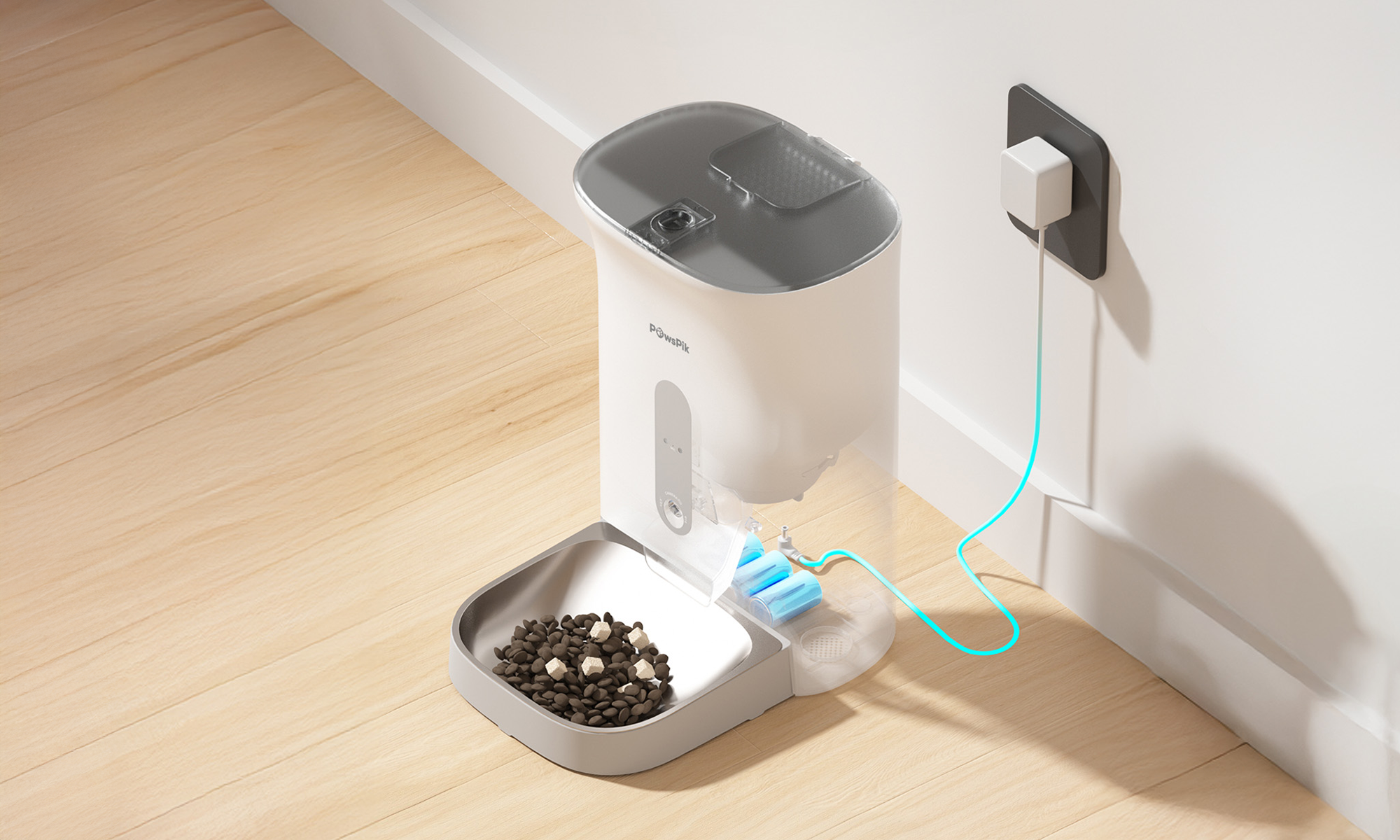 Automatic pet feeder with kibble, featuring a sleek, white design and a digital display. It's plugged into a wall socket with a glowing blue cable, placed on a wooden floor.