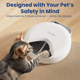 Load image into Gallery viewer, A curious tabby cat reaches towards PawsPik Smart Cat Feeder, designed to stop instantly if claws are detected, ensuring pet safety.

