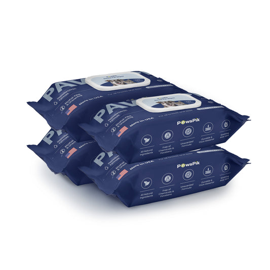 Stack of four dark blue colored cat cleaning wipes by PawsPik with white text and an image of a dog on it.