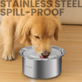 Load image into Gallery viewer, A golden retriever drinking from a stainless steel, spill-proof dog water bowl on a wooden floor, showcasing its design and functionality.
