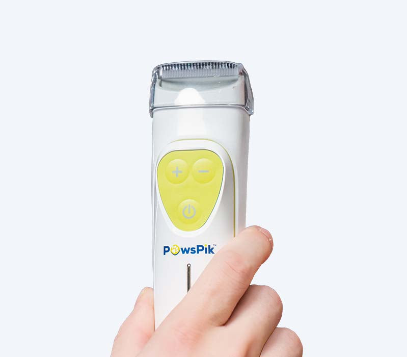a person holding the grooming pro rx clipper